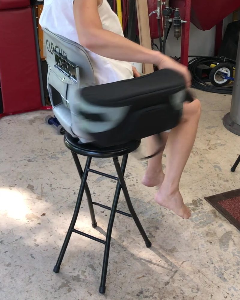The pack swinging around the side of the seat